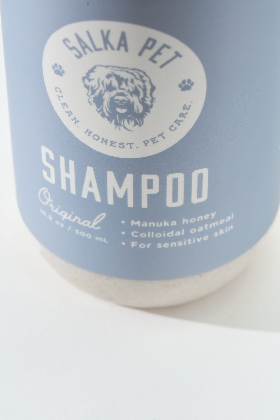 SalkaPet hypoallergenic dog shampoo bottle showing Manuka honey and colloidal oatmeal on the label