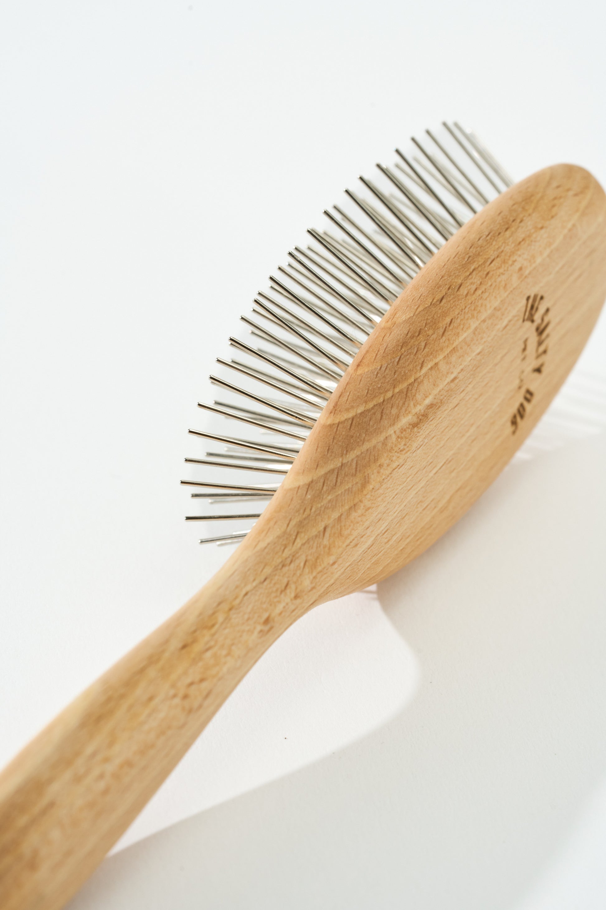 SalkaPet Tiny Tamer dog brush side view — fine pins for detail areas like face, ears, and paws